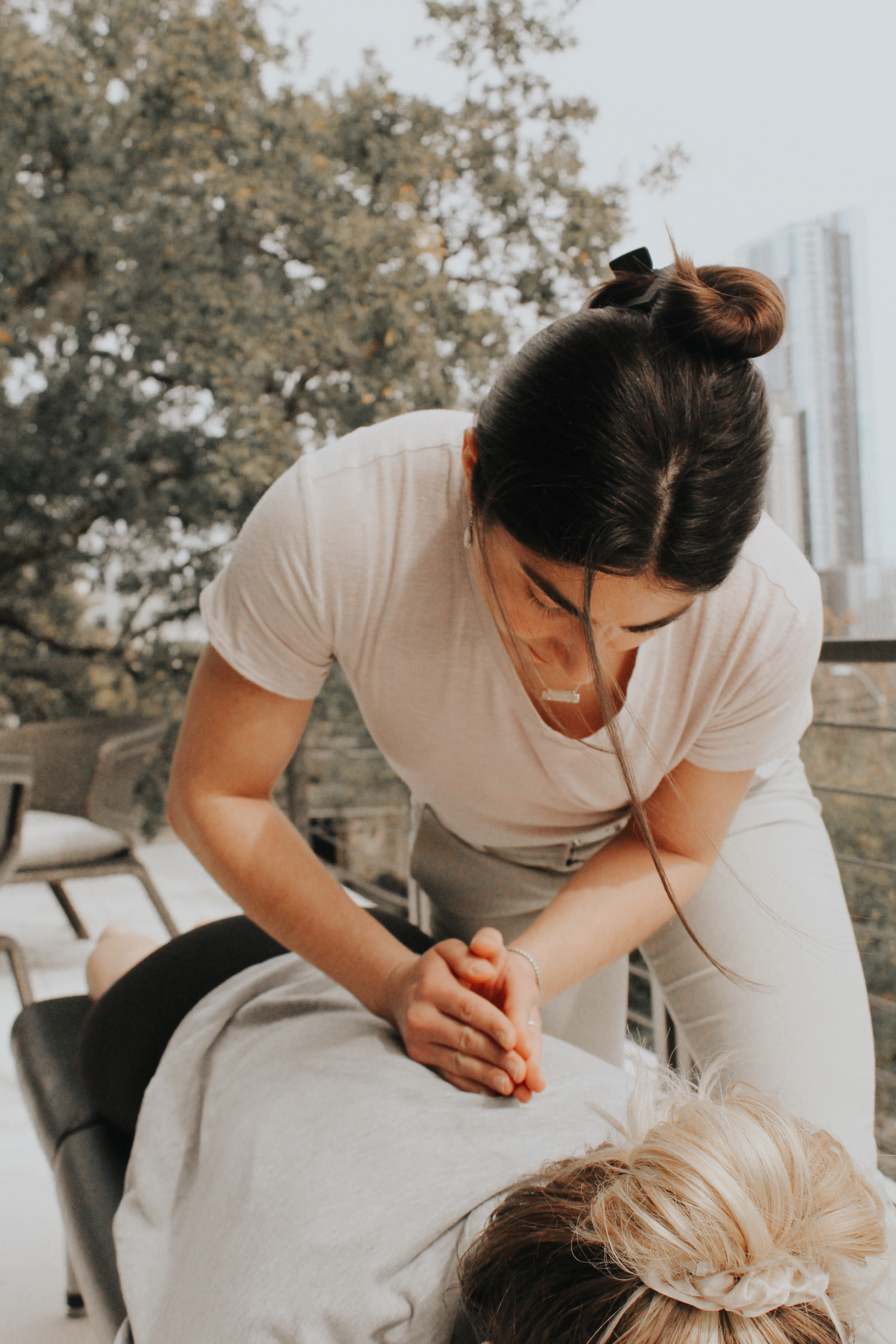 Dr. Syra providing hands-on chiropractic care